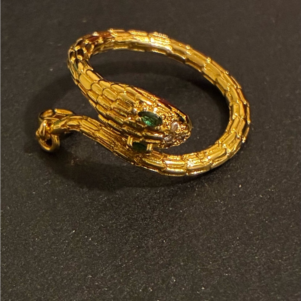 Gold plated snake ring. Emerald  green Accent eyes size 7-9.
